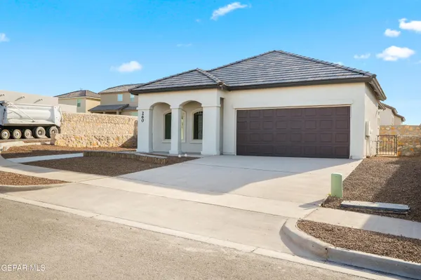 a front view of a house with a garage