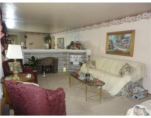 1437 Grove Road Castle Shannon, PA 15236 - Photo 6 of 18 Living Room. living room with furniture --carpet have been removed to expose hardwood flooring