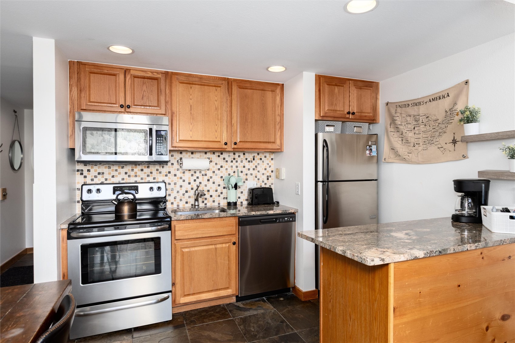 22340 Highway 6, Unit 1804 Keystone, CO 80435 - Photo 16 of 49 a kitchen with a stove and a refrigerator