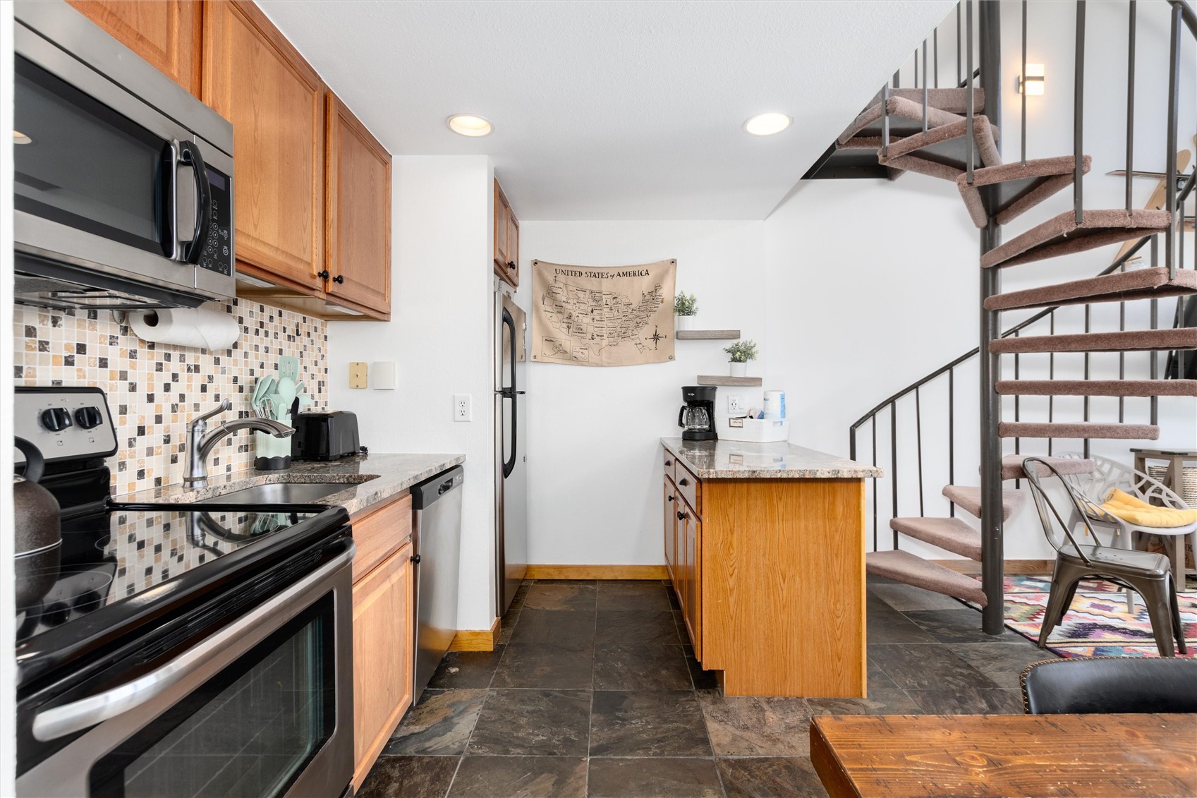 22340 Highway 6, Unit 1804 Keystone, CO 80435 - Photo 19 of 49 a kitchen with a stove and a microwave
