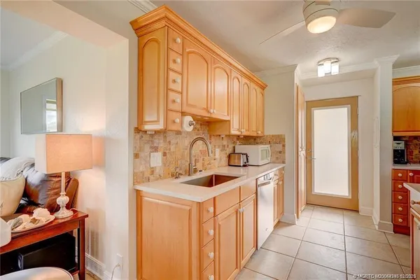 a kitchen with stainless steel appliances granite countertop a sink and cabinets