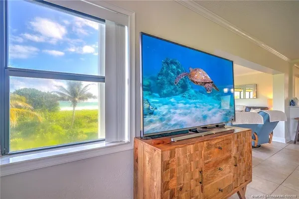 a view of a living room with a flat screen tv