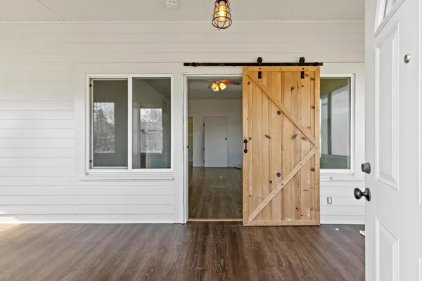 a view of a hardwood & staircase