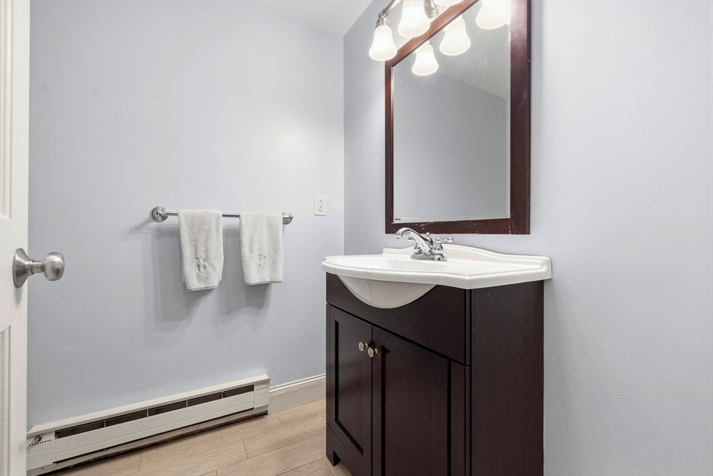 35 High Street, Unit 1 Boston, MA 02129 - Photo 16 of 33 a bathroom with a sink vanity and mirror