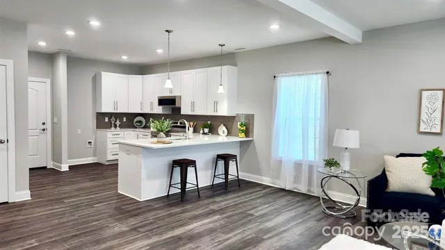a view of kitchen with breakfast area