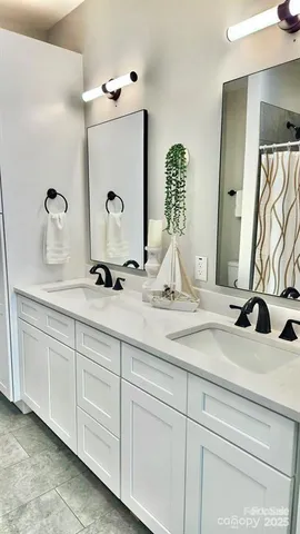 a bathroom with a white bath tub and a shower