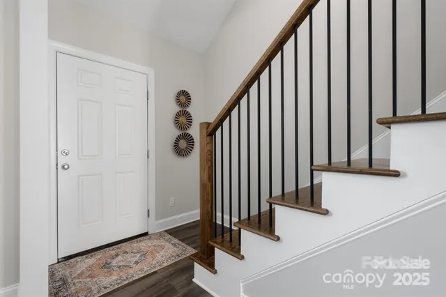 a view of staircase with wooden floor and stairs
