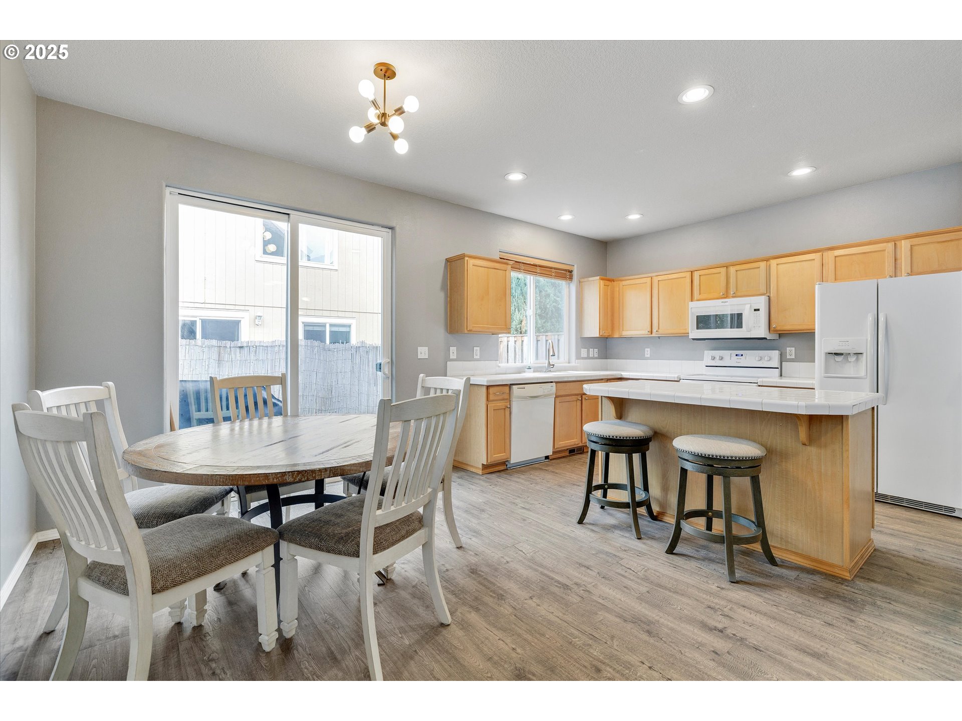 17645 Southwest Jay Street Beaverton, OR 97003 - Photo 13 of 31 a view of kitchen with cabinets table and chairs