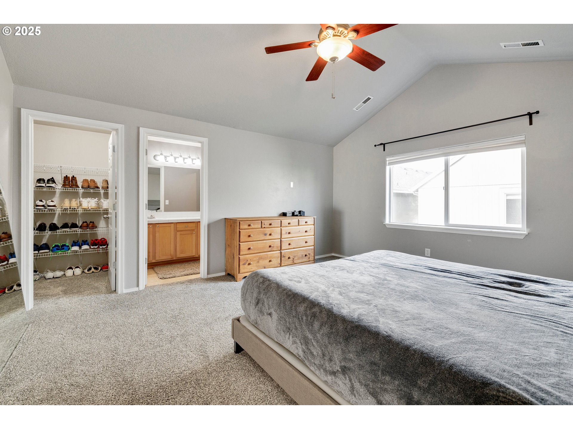 17645 Southwest Jay Street Beaverton, OR 97003 - Photo 19 of 31 a bedroom with a bed and a chandelier