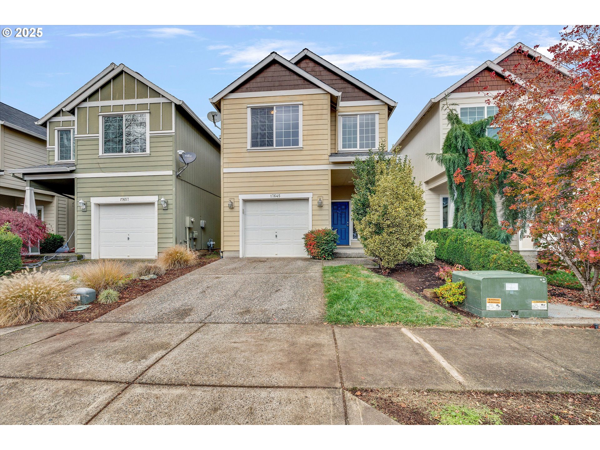 17645 Southwest Jay Street Beaverton, OR 97003 - Photo 2 of 31 a front view of a house with a yard and a garage