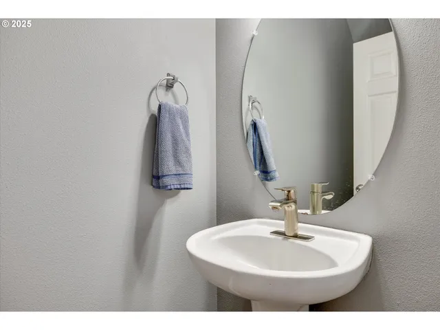 a bathroom with a sink and mirror