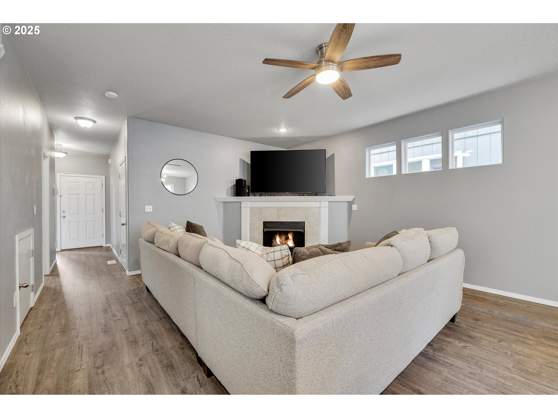 17645 Southwest Jay Street Beaverton, OR 97003 - Photo 7 of 31 a living room with furniture and a fireplace