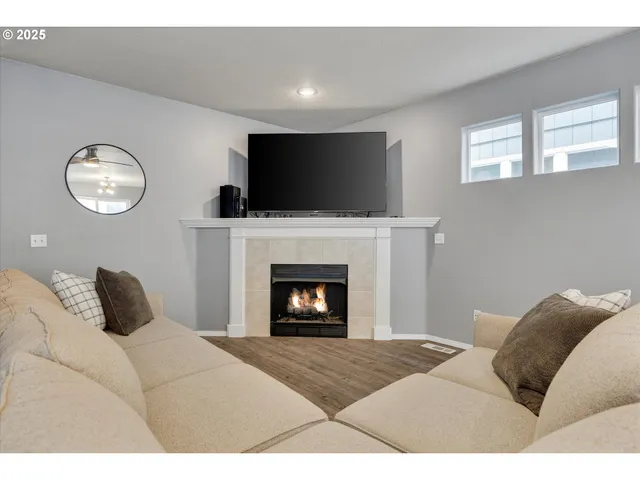 a bedroom with a bed and a fireplace