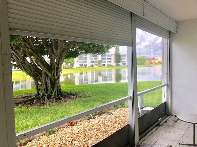1061 Cornwall East, Unit 1061 Boca Raton, FL 33434 - Photo 13 of 23 Screened Patio with Pull Downs