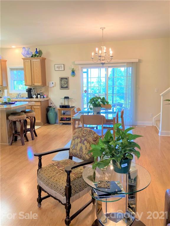 1821 Cove Road Rutherfordton, NC 28139 - Photo 11 of 46 a living room with furniture a chandelier and a dining table