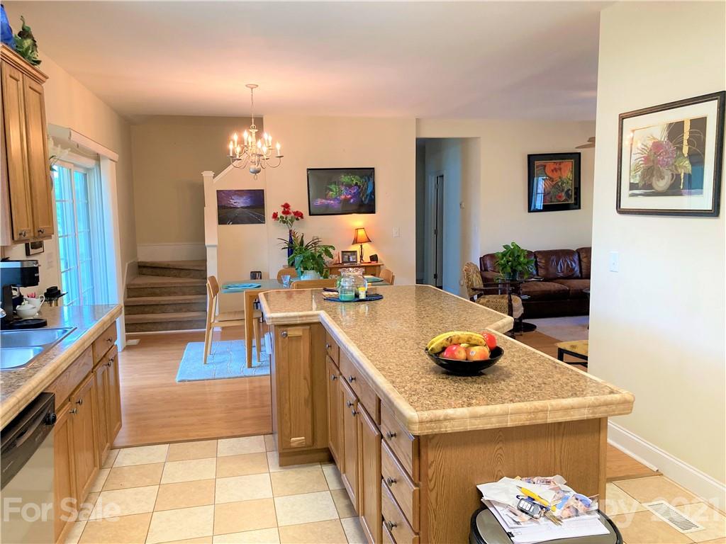 1821 Cove Road Rutherfordton, NC 28139 - Photo 15 of 46 a kitchen with a sink and a stove top oven with wooden floor