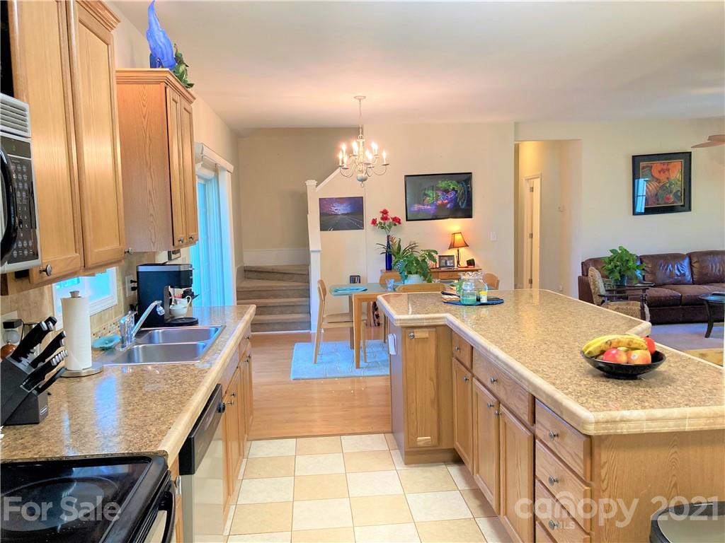 1821 Cove Road Rutherfordton, NC 28139 - Photo 16 of 46 a kitchen with a sink stove and cabinets