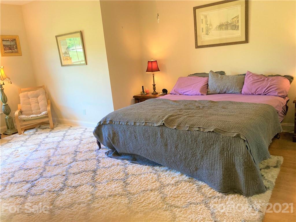 1821 Cove Road Rutherfordton, NC 28139 - Photo 18 of 46 a bedroom with a bed and a painting on the wall