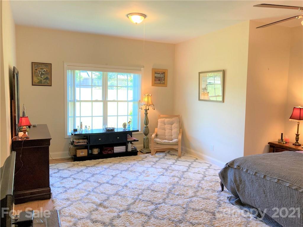1821 Cove Road Rutherfordton, NC 28139 - Photo 19 of 46 a spacious bedroom with a bed and a window