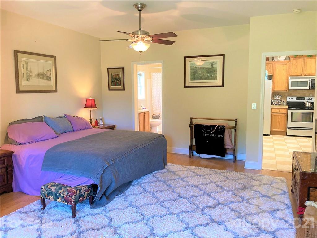 1821 Cove Road Rutherfordton, NC 28139 - Photo 20 of 46 a bedroom with a bed and a fireplace