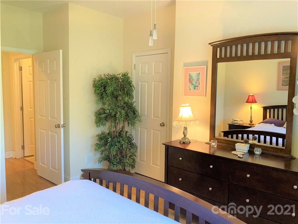 1821 Cove Road Rutherfordton, NC 28139 - Photo 27 of 46 a bedroom with a bed and a dresser in it