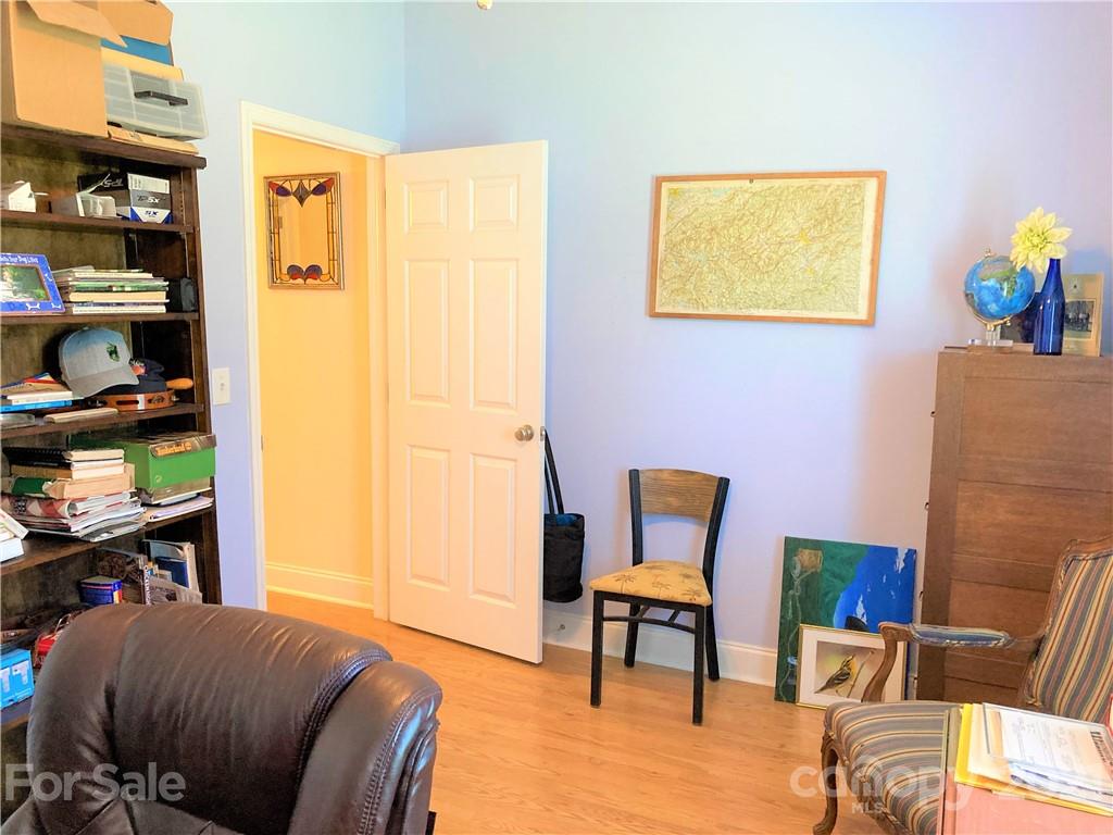 1821 Cove Road Rutherfordton, NC 28139 - Photo 32 of 46 a bedroom with a bed and a chair in it