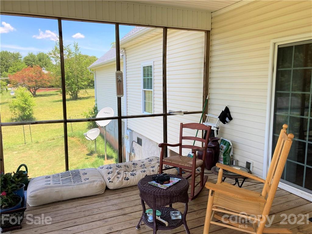 1821 Cove Road Rutherfordton, NC 28139 - Photo 5 of 46 a living room with furniture and a floor to ceiling window