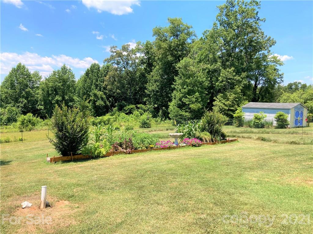 1821 Cove Road Rutherfordton, NC 28139 - Photo 44 of 46 a view of a house with a yard and sitting area