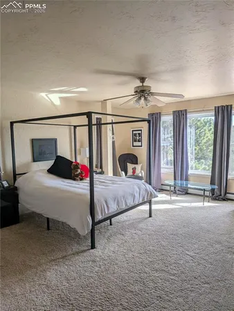 a kitchen with granite countertop a stove and cabinets