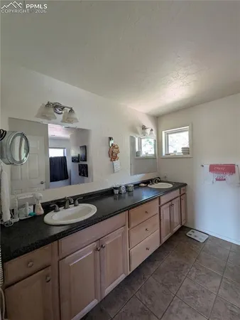 a bathroom with a tub and a shower