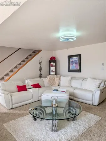 a living room with furniture and a couch