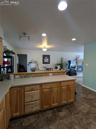 a kitchen with sink and cabinets