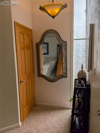 a bedroom with double bed and a large window