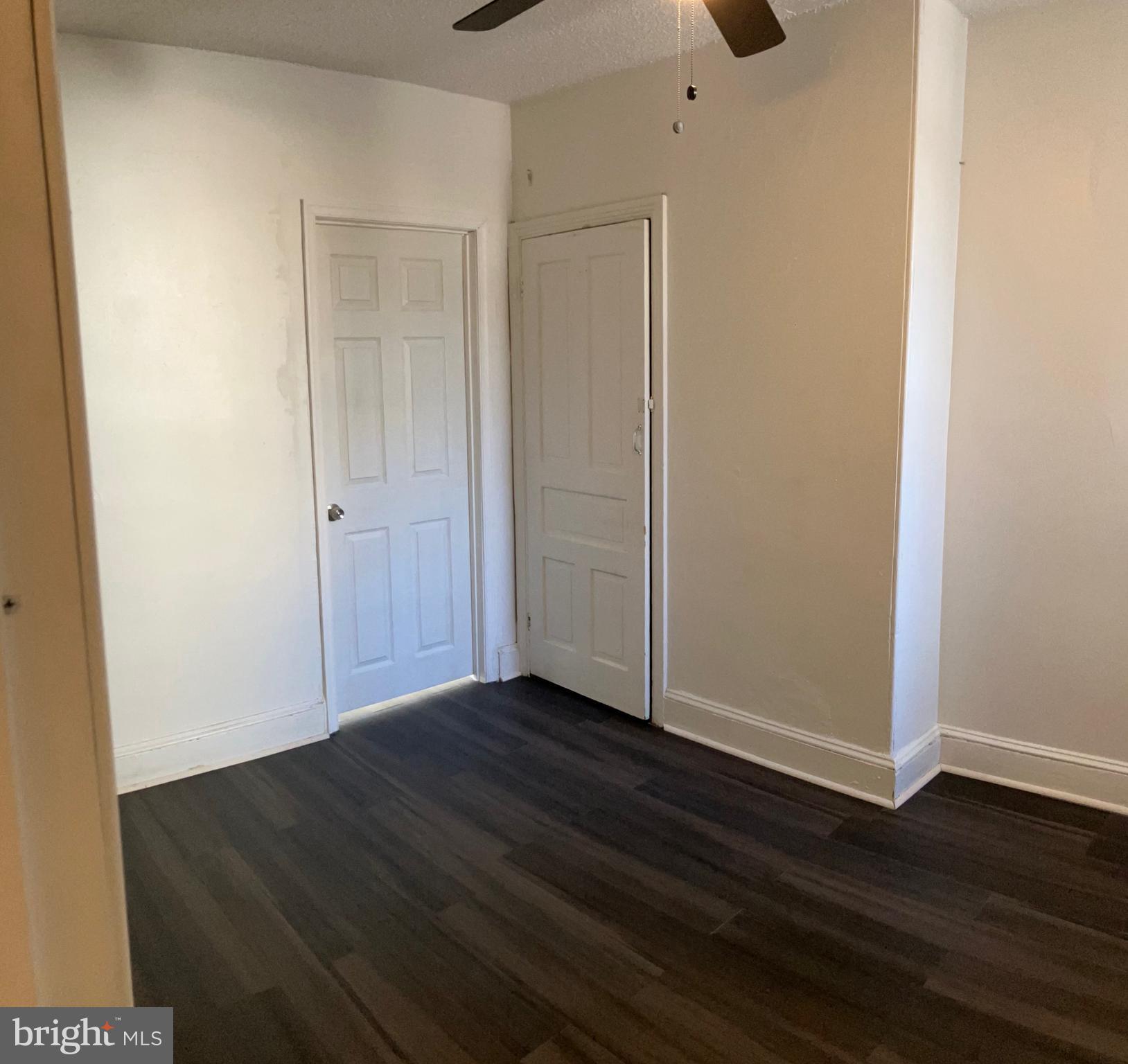 2215 Catharine Street, Unit 2 Philadelphia, PA 19146 - Photo 8 of 11 a view of an empty room with wooden floor