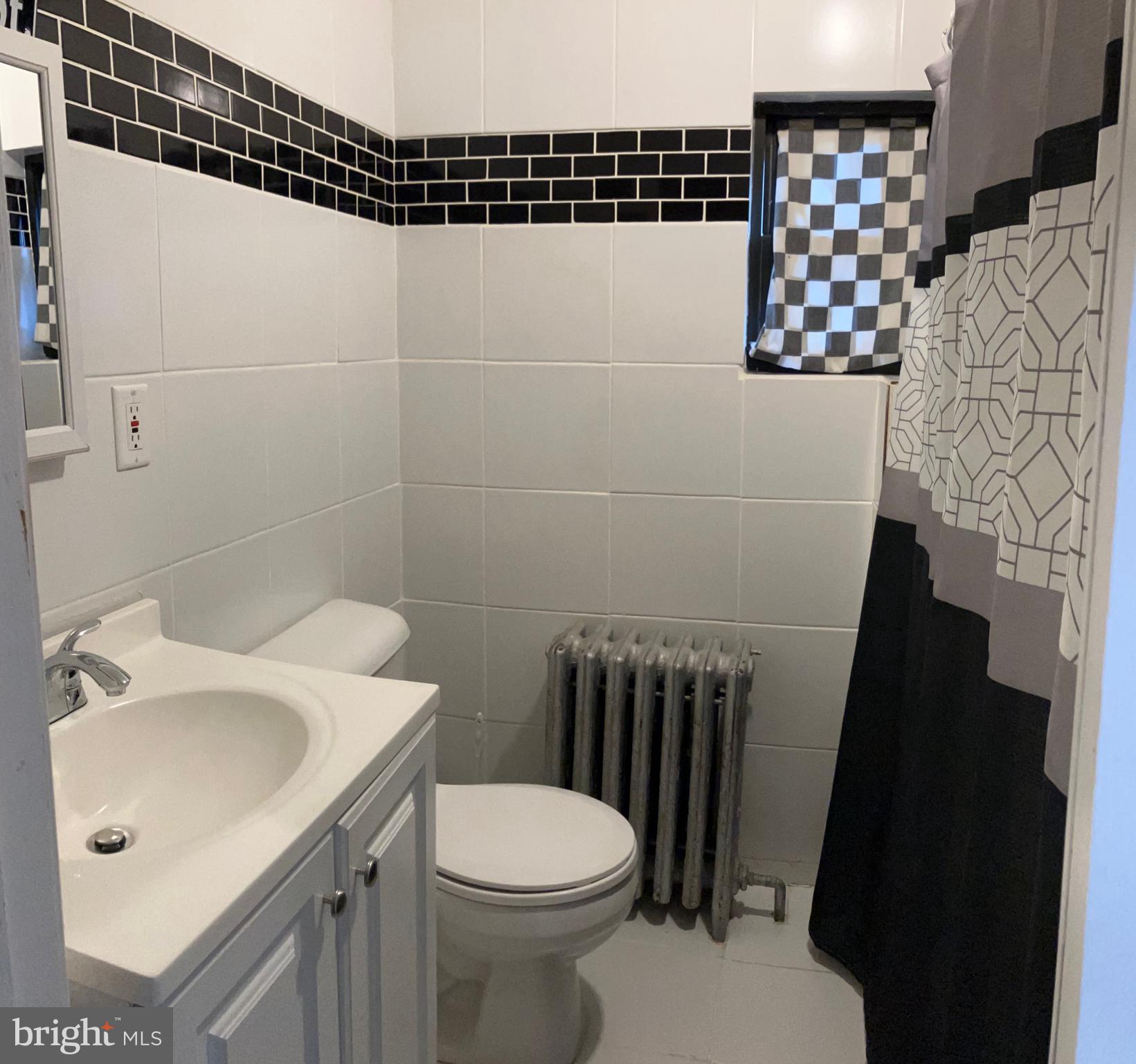 2215 Catharine Street, Unit 2 Philadelphia, PA 19146 - Photo 10 of 11 a bathroom with a sink toilet and shower