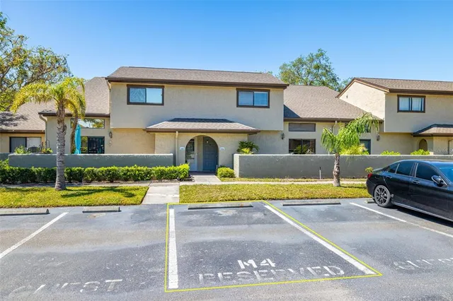 a view of a house with swimming pool and a yard