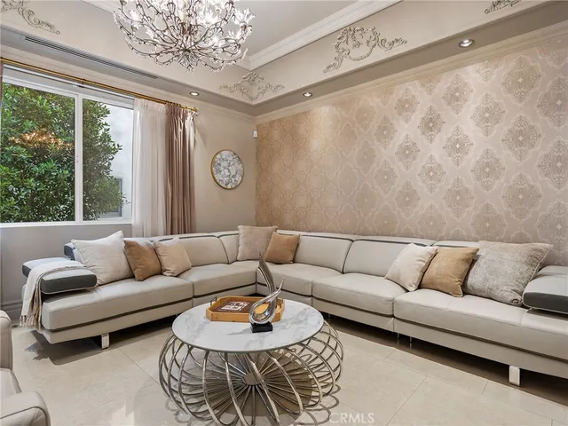 a living room with furniture a rug and a large window