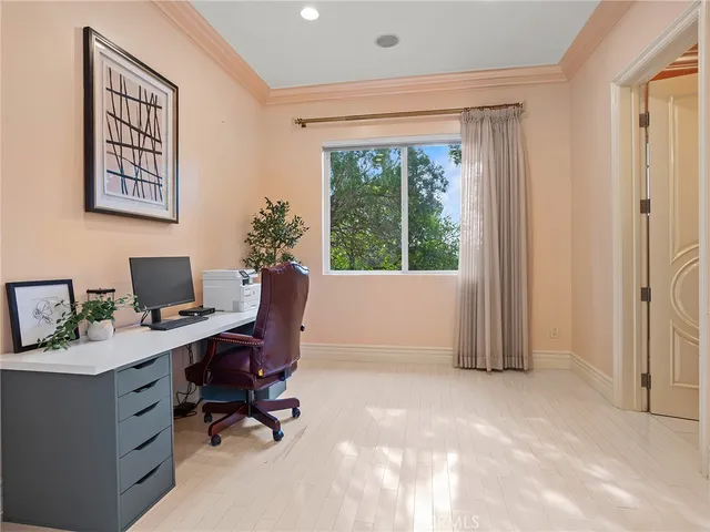 a bathroom with a granite countertop sink a mirror and shower