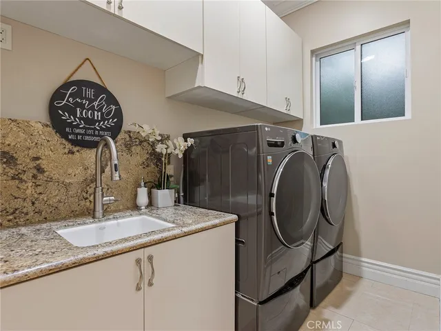 a front view of a house with a garden and yard