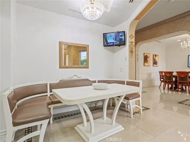 a kitchen with stainless steel appliances granite countertop white cabinets and window