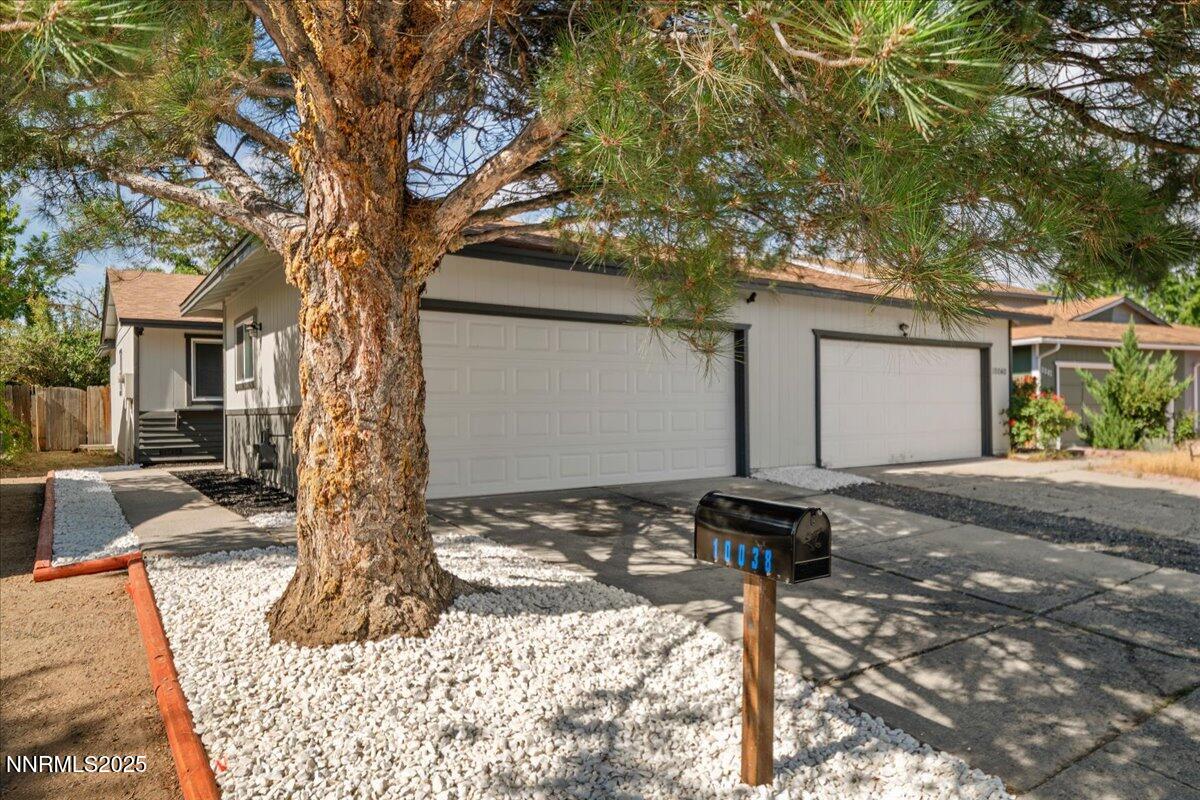 10038 Humite Lane Reno, NV 89506 - Photo 1 of 30 a front view of a house with parking area
