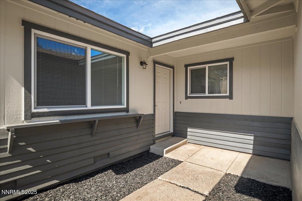 10038 Humite Lane Reno, NV 89506 - Photo 4 of 30 a view of front door of house