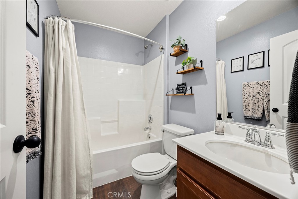 7357 Max Way Eastvale, CA 92880 - Photo 12 of 39 a bathroom with a sink toilet and shower