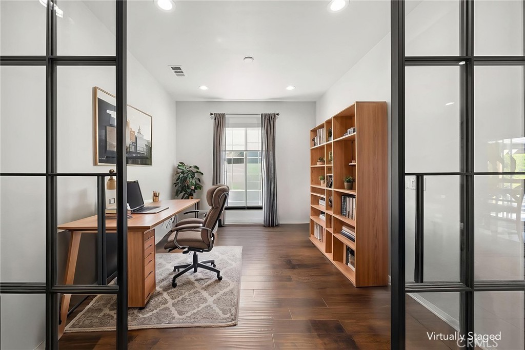 7357 Max Way Eastvale, CA 92880 - Photo 14 of 39 a view of a hallway with furniture and refrigerator