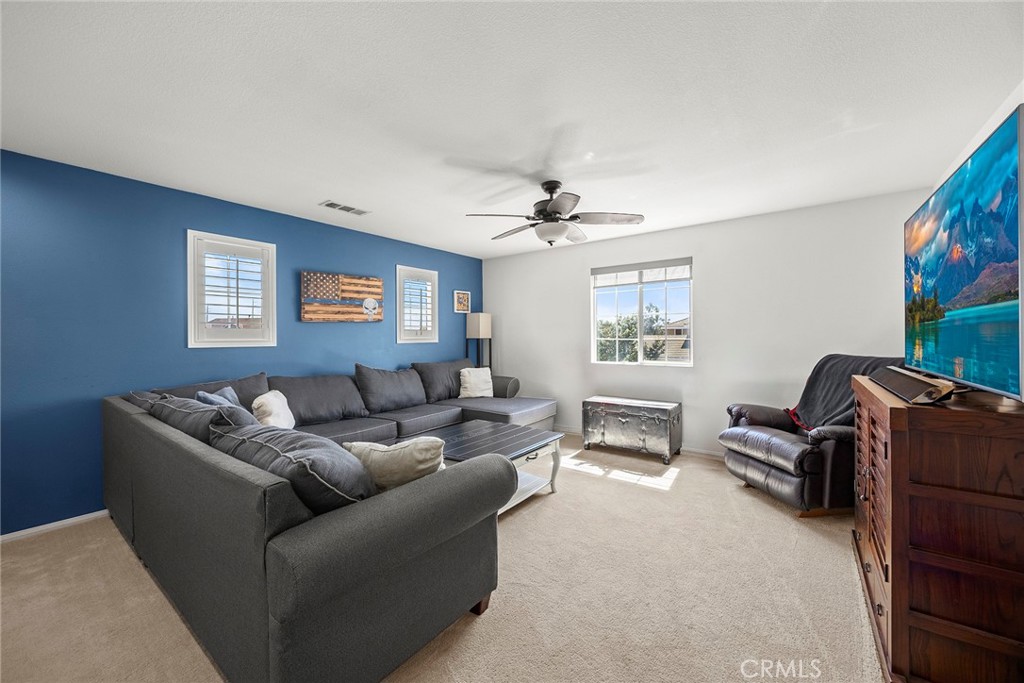 7357 Max Way Eastvale, CA 92880 - Photo 15 of 39 a living room with furniture and a window