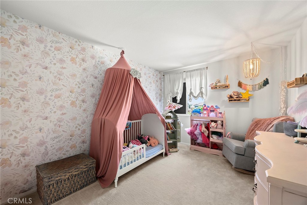7357 Max Way Eastvale, CA 92880 - Photo 17 of 39 a room with furniture and a baby crib