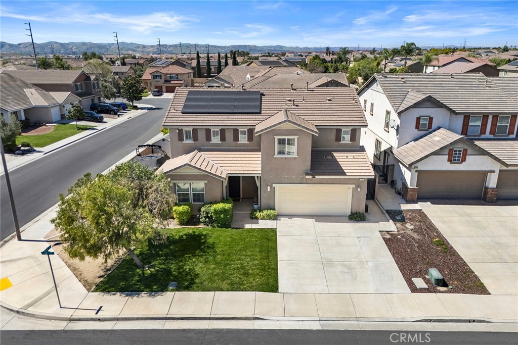 7357 Max Way Eastvale, CA 92880 - Photo 2 of 39 an aerial view of a house with a yard basket ball court and outdoor seating