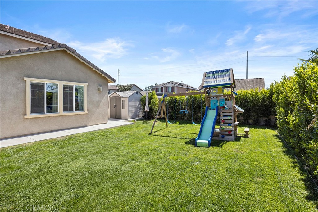 7357 Max Way Eastvale, CA 92880 - Photo 28 of 39 a view of a backyard with a slide