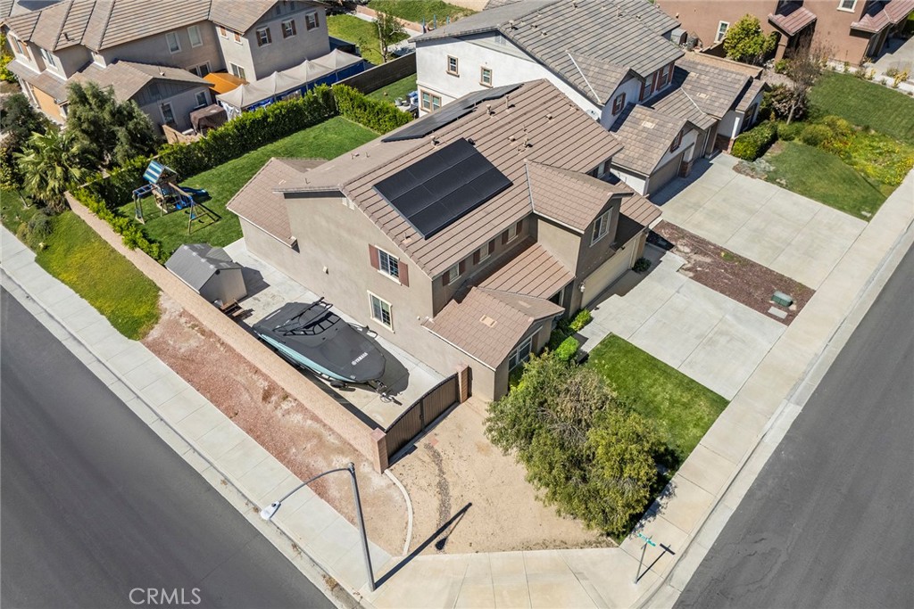 7357 Max Way Eastvale, CA 92880 - Photo 3 of 39 an aerial view of house with yard