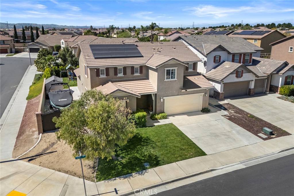 7357 Max Way Eastvale, CA 92880 - Photo 38 of 39 an aerial view of a house with a yard and balcony